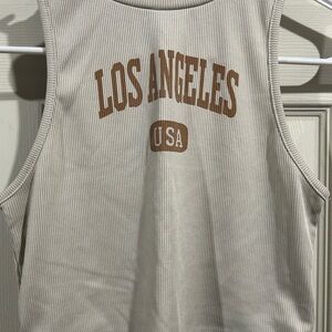 Cream Los Angeles crop top. Small turtle neck like top. Comfortable to wear.
